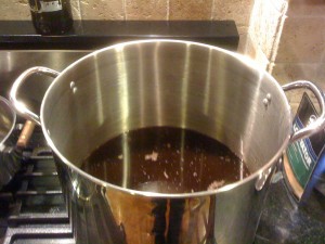 Remove grains and pour liquid into the brewing kettle
