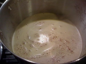 Remove boiling wort from heat and add malt extract