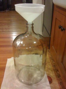 Carboy reading on towl with funnel